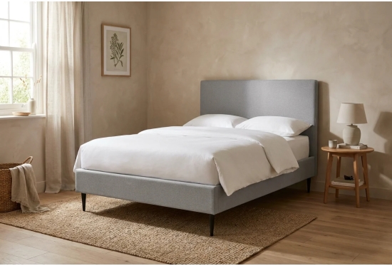 Air storage bed on legs in a calm bedroom, shown in Alpaka Cloud with an optional headboard
