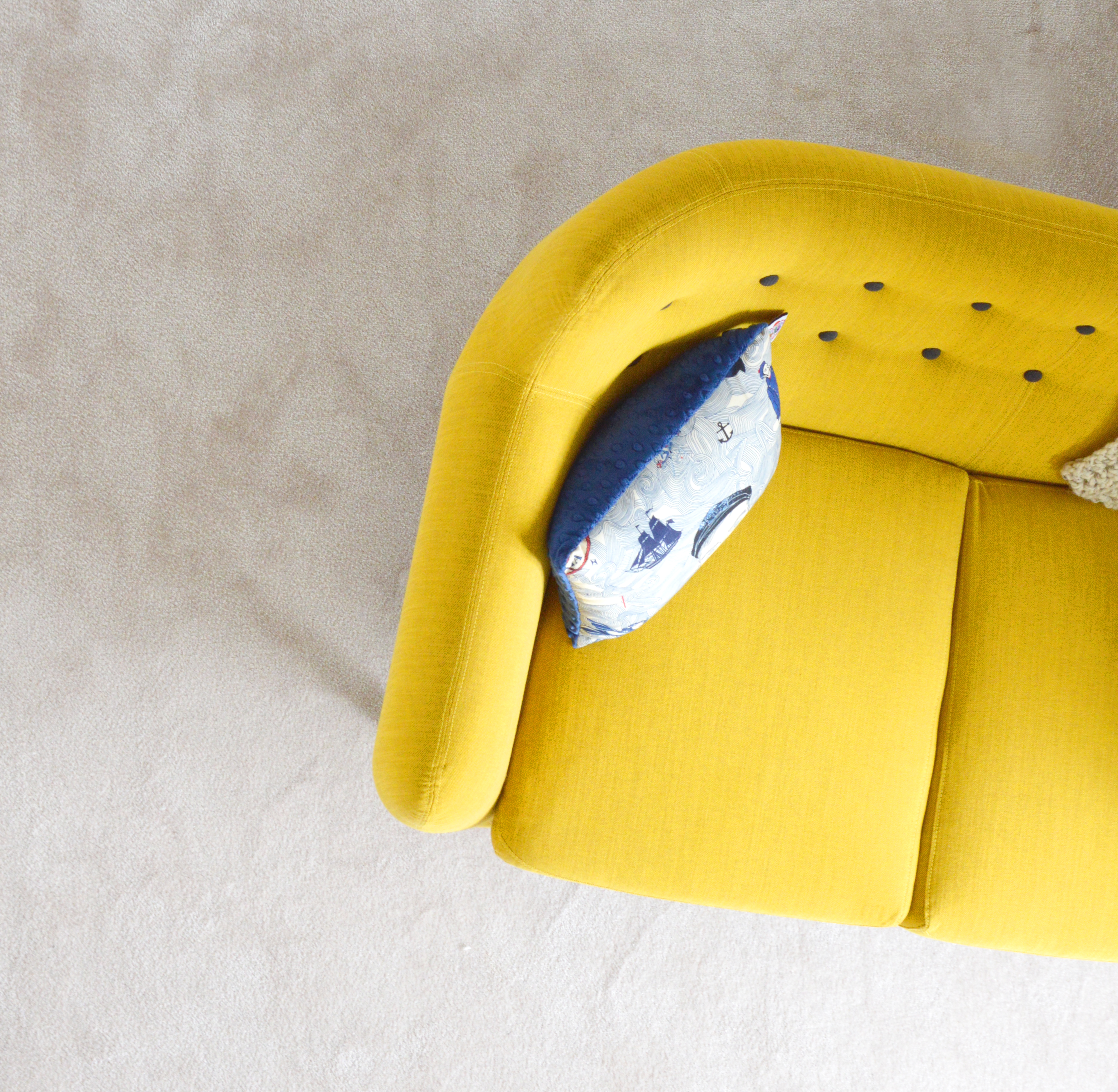 Add in a bold statement piece of furniture in one of the trending colours
