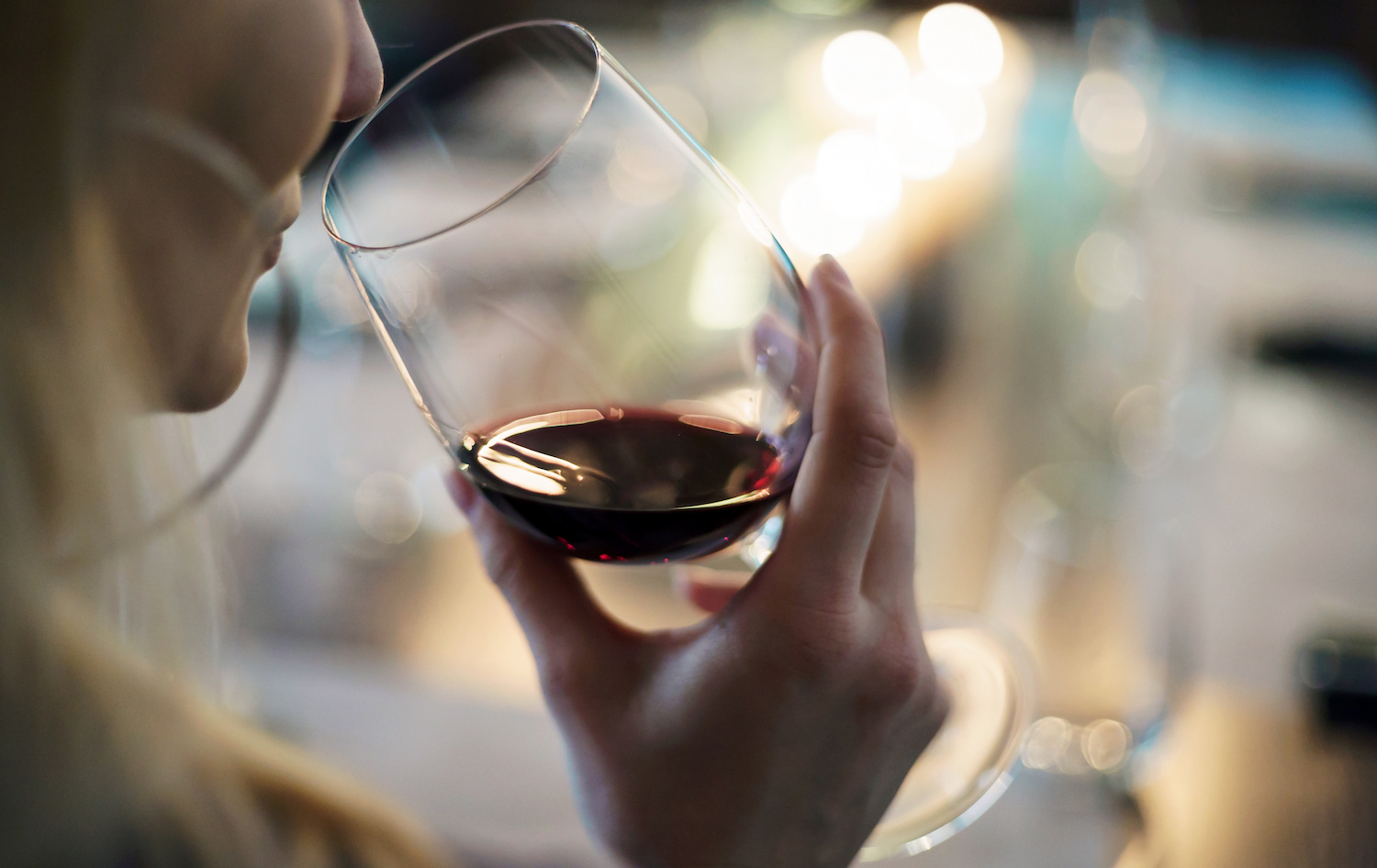 Woman drinking glass of red wine