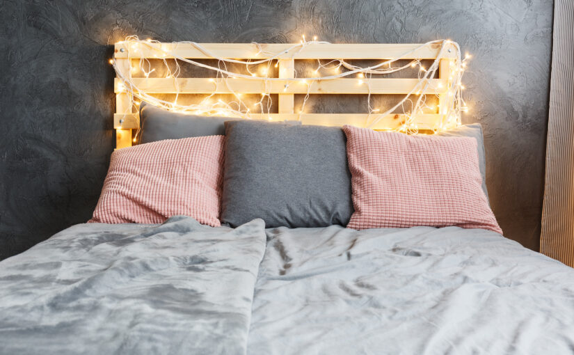 Wooden headboard with fairy lights