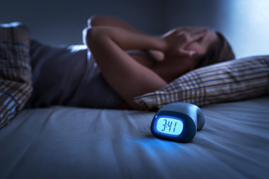 Woman laid awake in bed at night