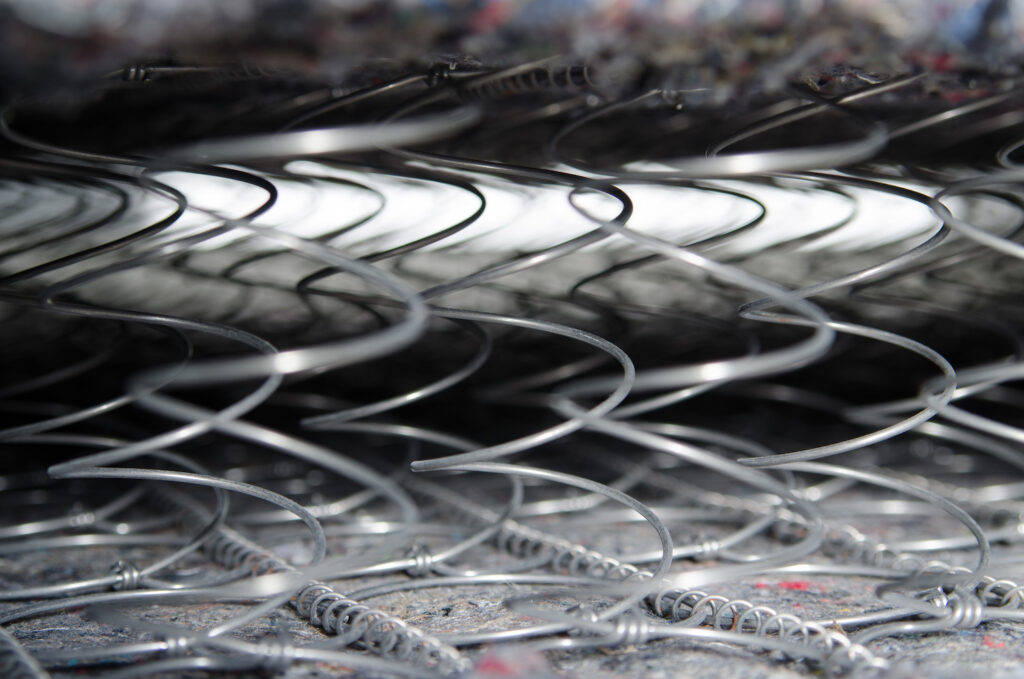 Springs in an open coil mattress
