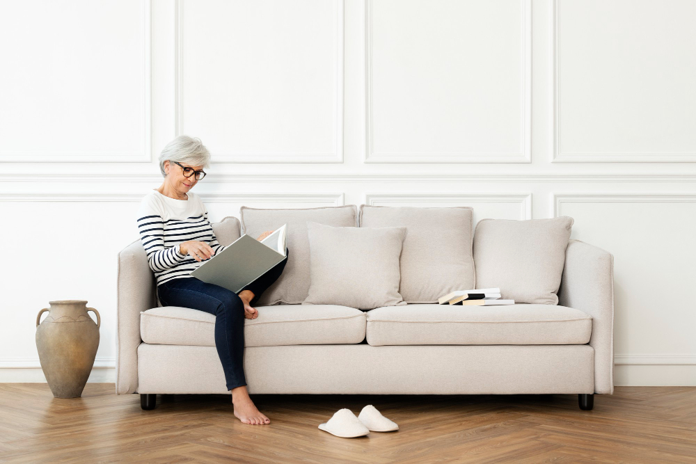 woman seating on sofa