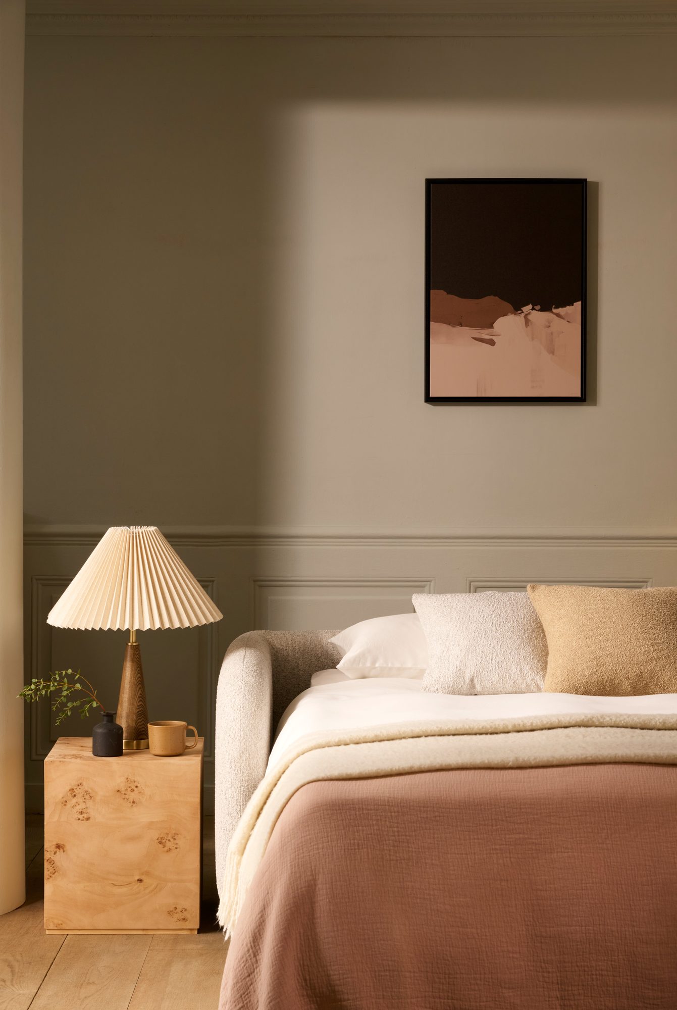 Cocoon sofa bed open — beautifully dressed, portrait