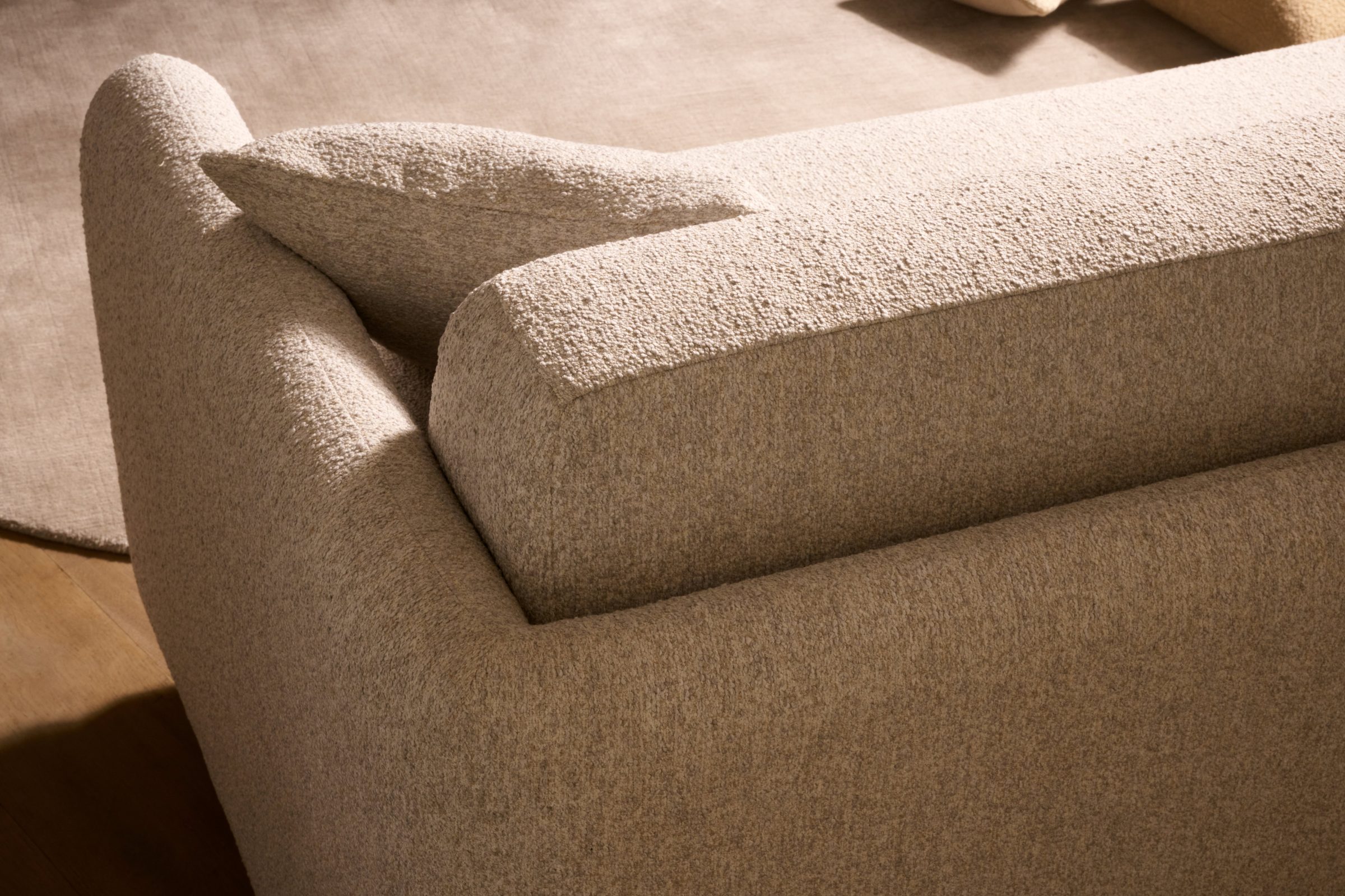Cocoon sofa — natural bouclé fabric detail