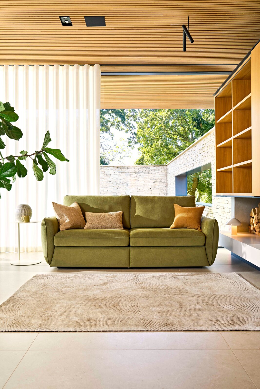 Close-up of the Mellow sofa's back cushion and bolster showing soft chenille upholstery