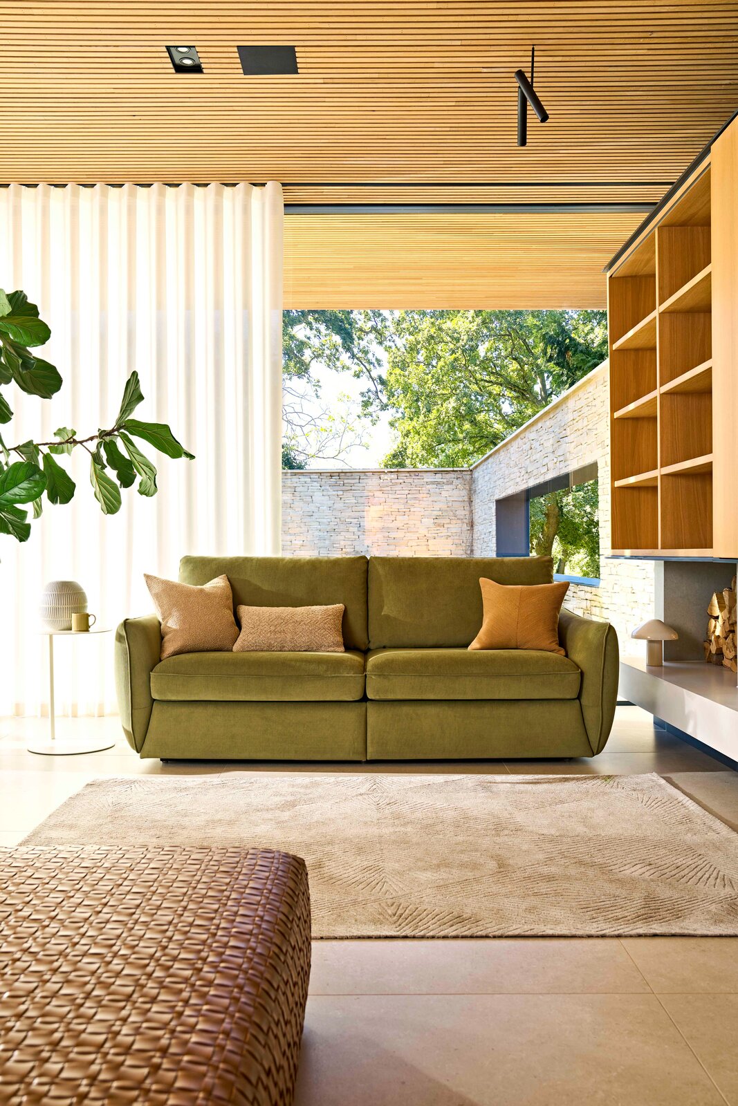 Mellow storage sofa with the pull-out storage drawer open, showing the deep storage space
