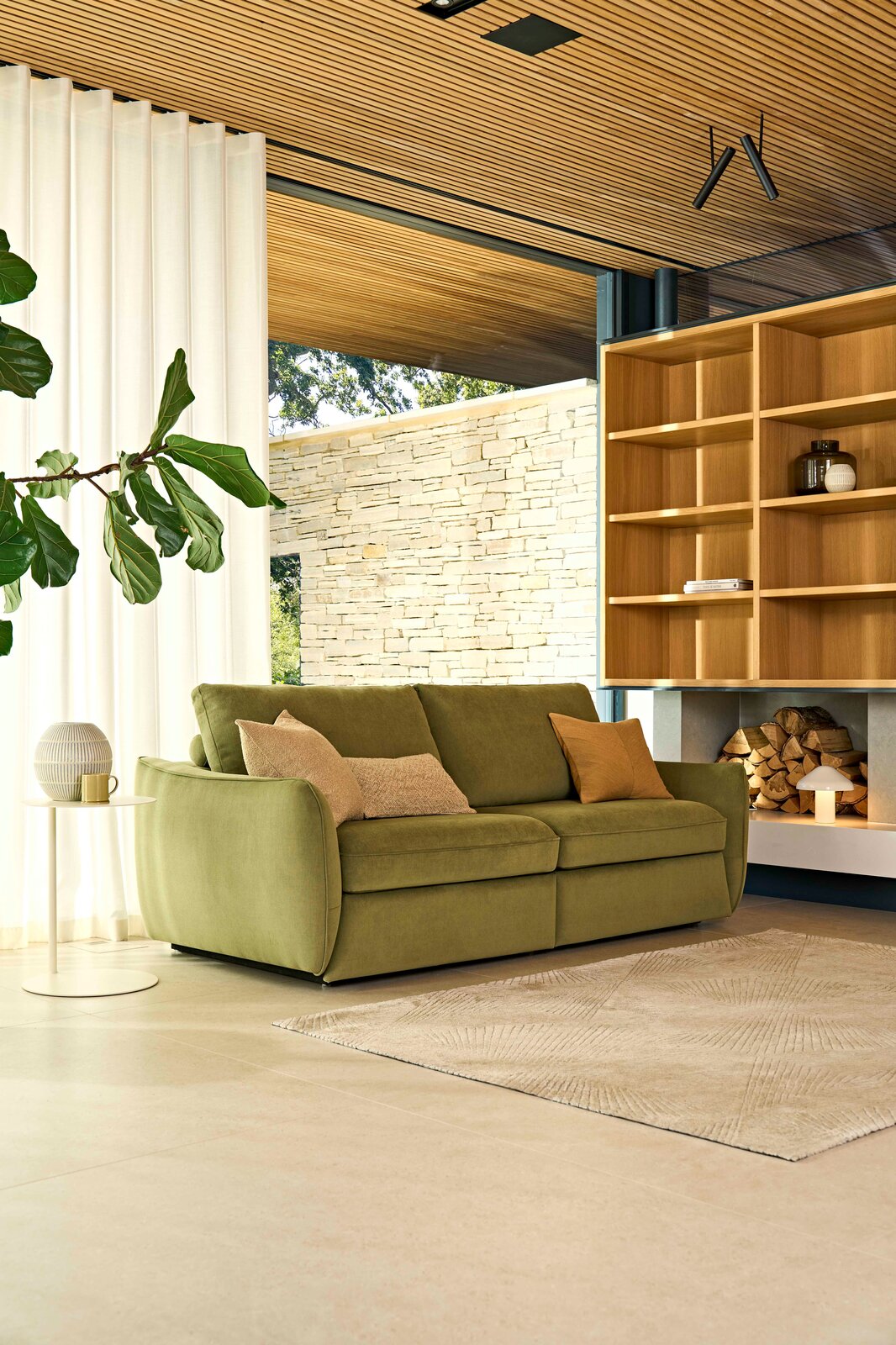 Close-up of Mellow sofa arm detail showing the soft curved silhouette