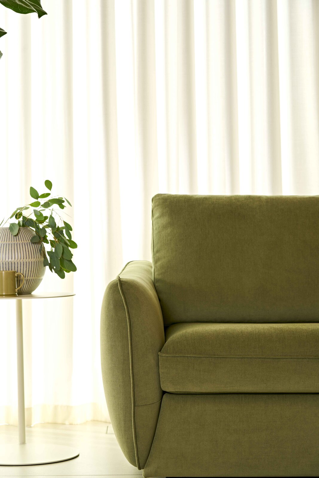 Mellow storage sofa in a wide living room scene