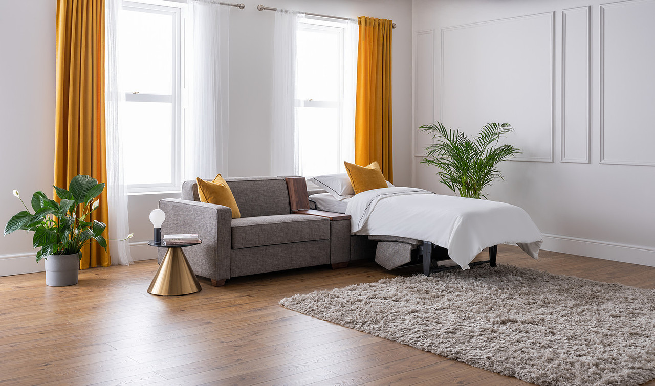 Side by Side sofa converted into two independent single beds, both made up with white linen
