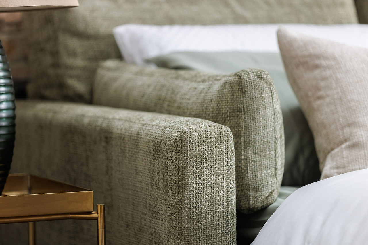 The Sunday sofa bed front view — deep seat, soft pillow back, generous proportions