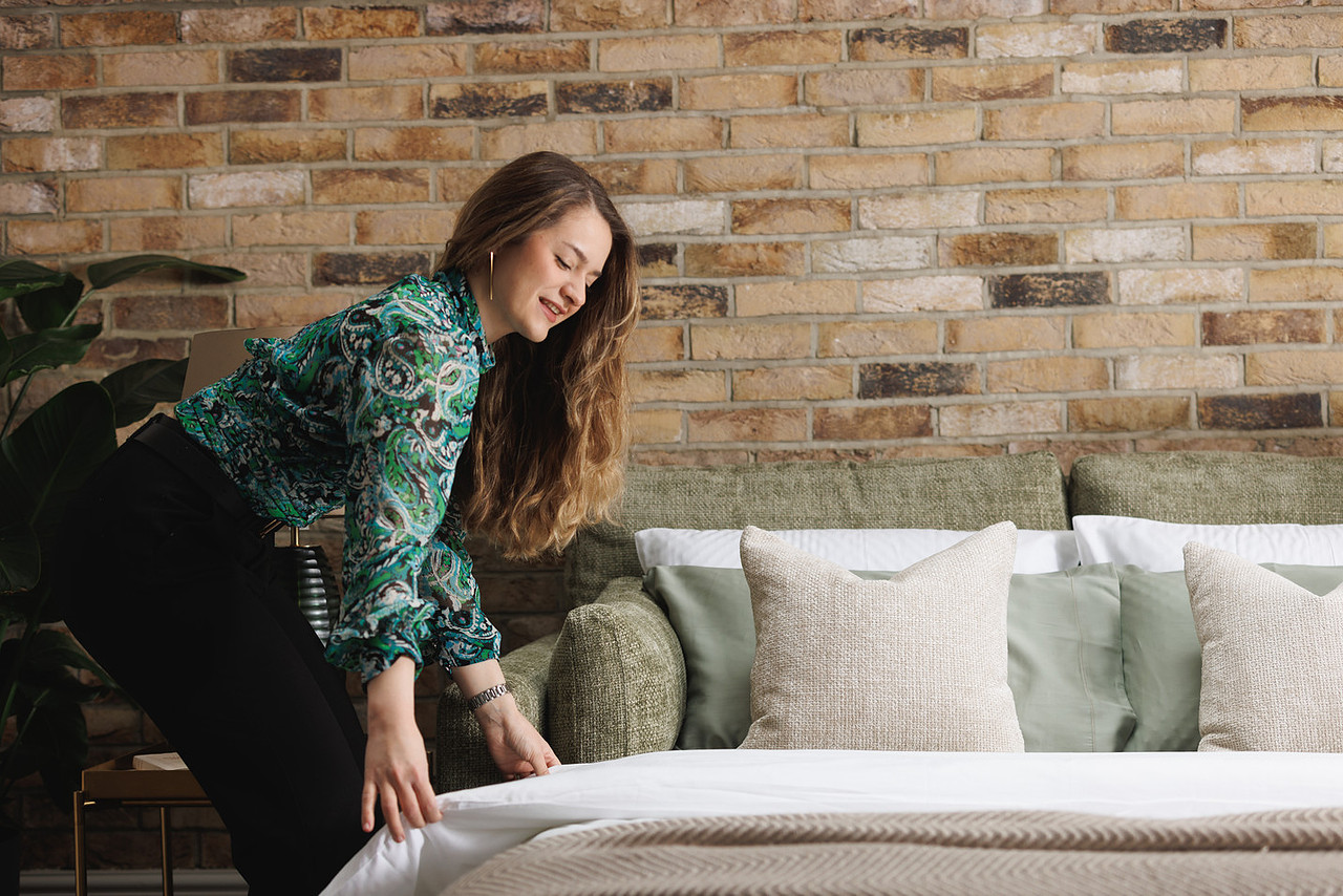 Making up the Sunday sofa bed — the fold-out bed in action