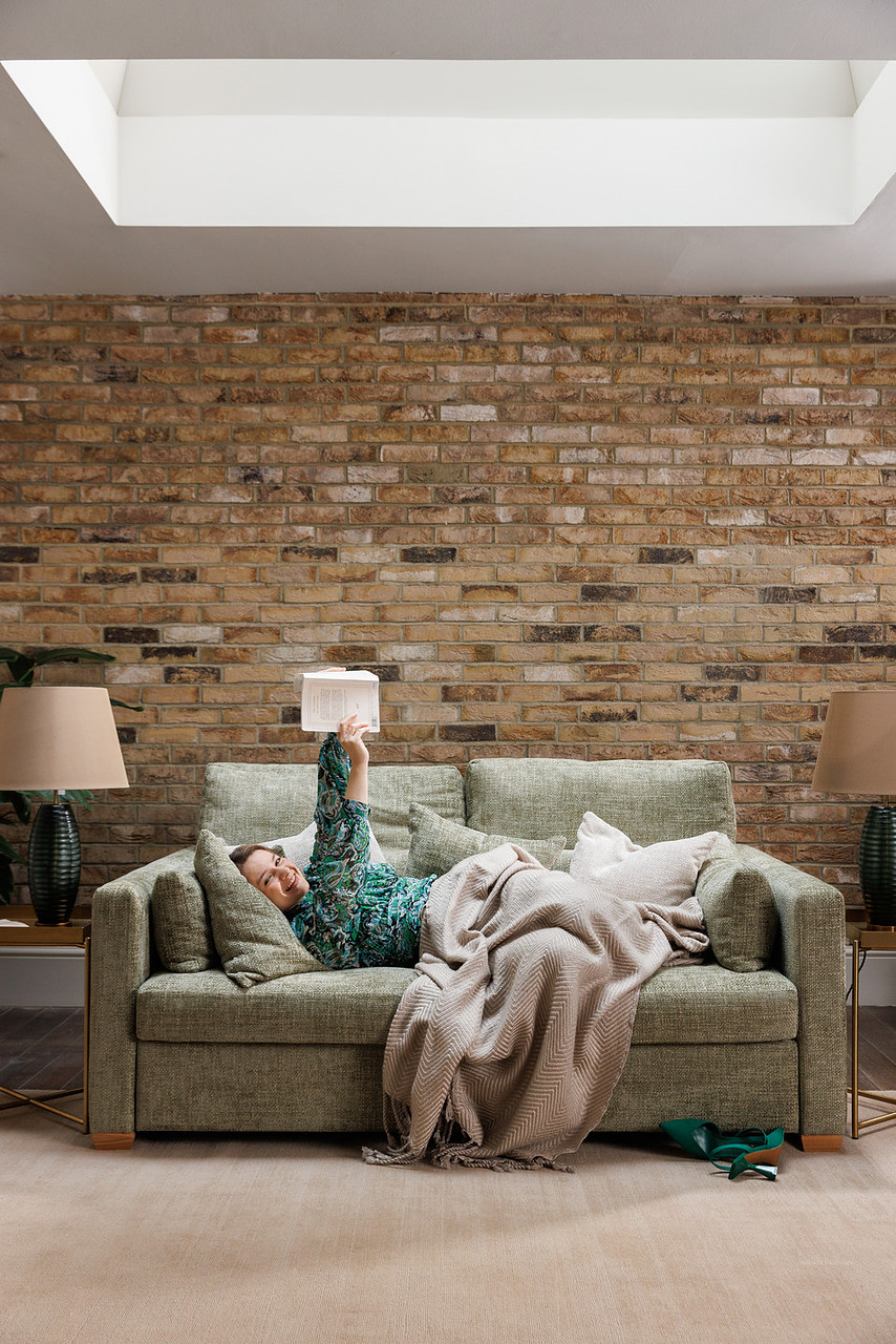 Lying back to read on the Sunday sofa bed — the deep seat used full-length