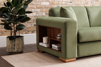 Vibrant green couch with side storage feature