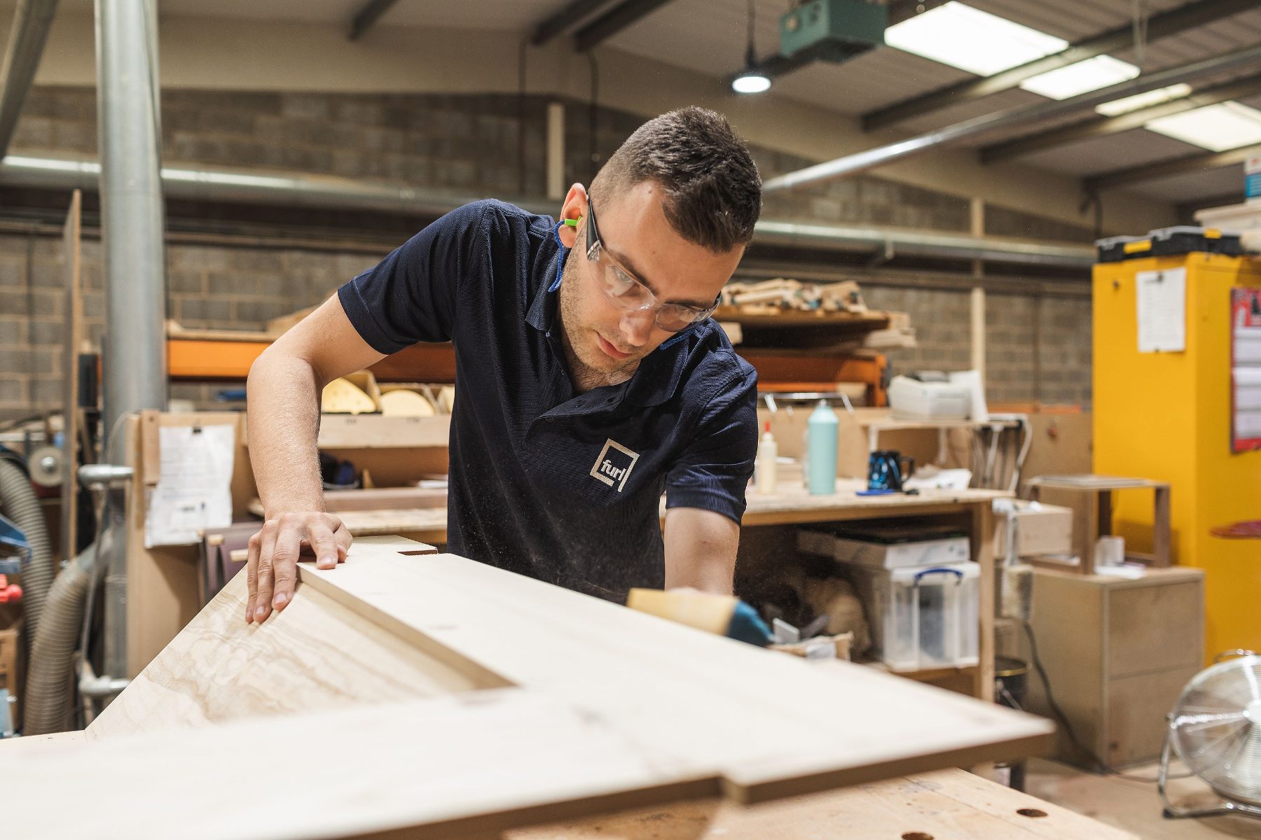 Sanding a hardwood component by hand