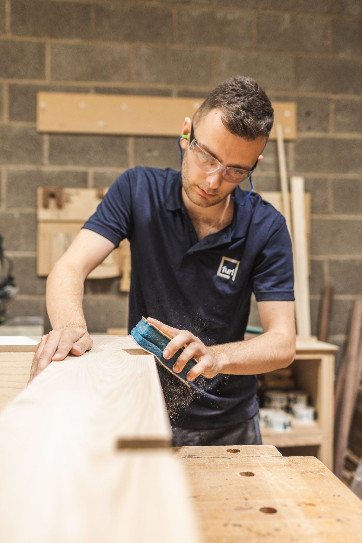 A Furl craftsman at work in the Calverton wood shop